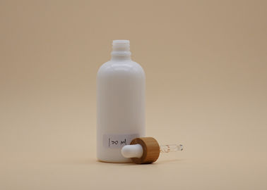 Butelki z zakraplaczem z białego szkła w kształcie cylindra 100 ml do opakowań kosmetycznych